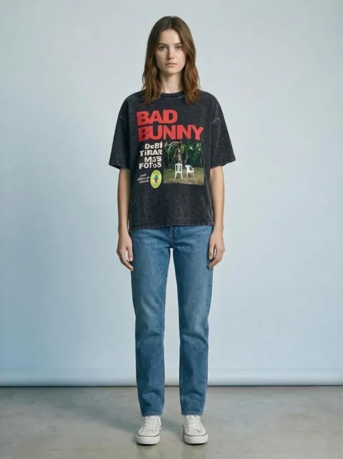Woman wearing acid-wash oversized Bad Bunny T-shirt with Debi Tirar Mas Fotos album-inspired graphic