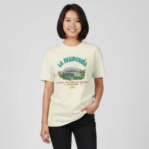 Woman wearing sand Bad Bunny T-shirt with La Residencia Coliseo Jose Miguel Agrelot souvenir graphic