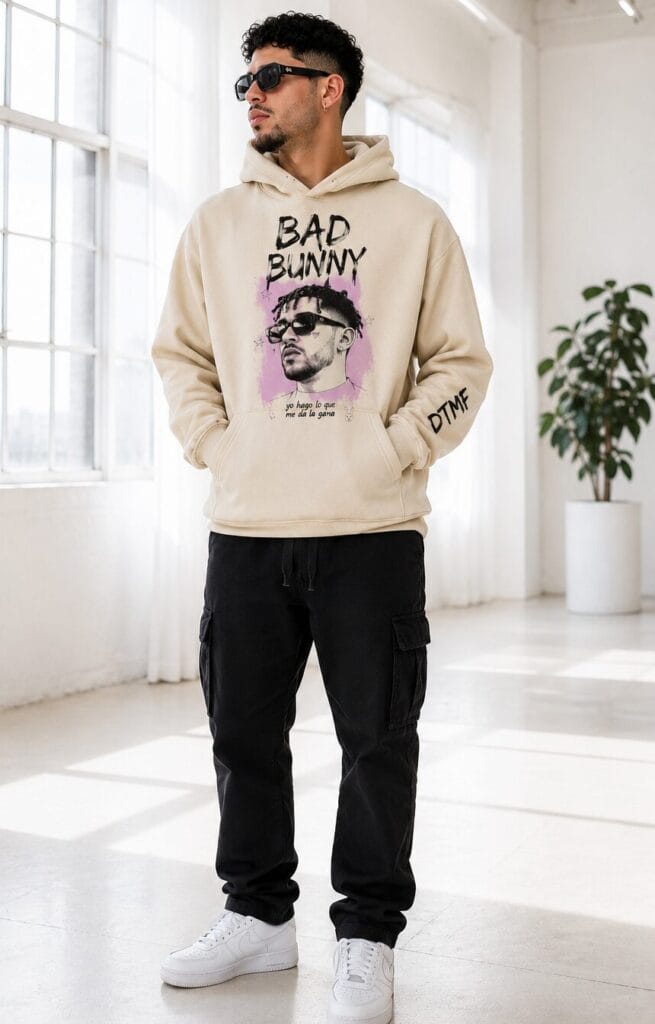 Model wearing a tan Bad Bunny fan-inspired hoodie, illustrating true-to-size unisex fit